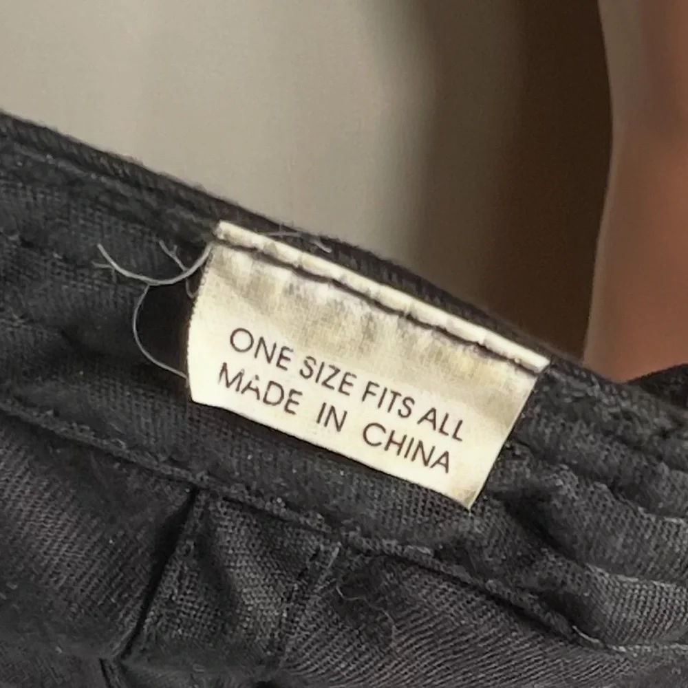 A one size fits all Black ball Cap 
